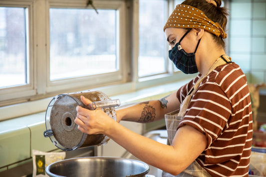Chef Madeline Krantz making vegan black bean burgers in Des Moines, Iowa