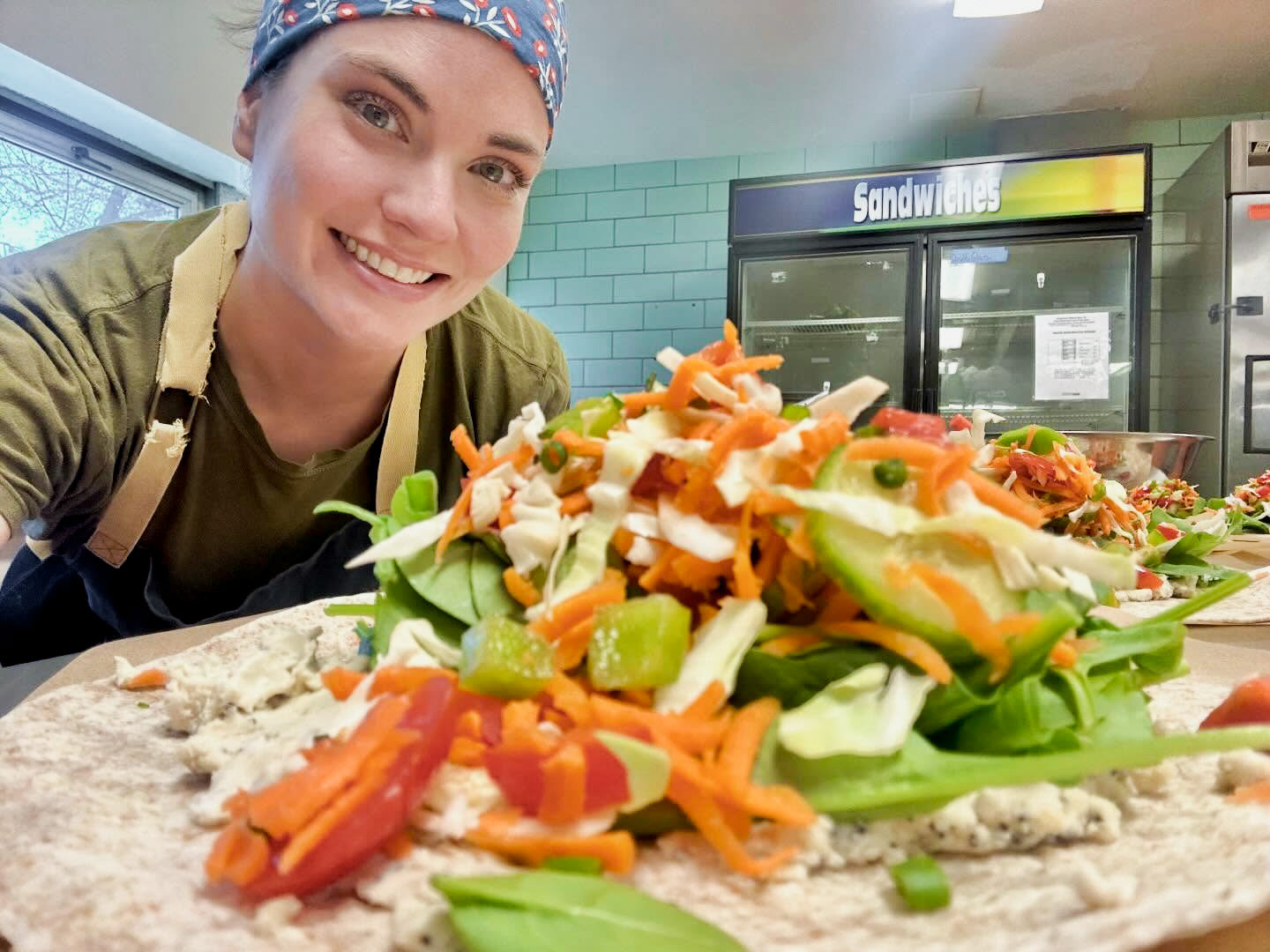 Chef Madeline Krantz with vegan wraps in Des Moines, Iowa