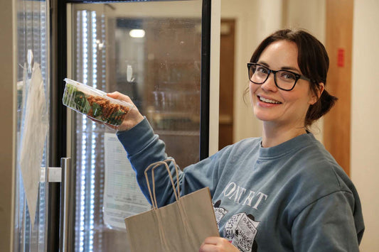 Chef Madeline Krantz bagging vegan food in Des Moines, Iowa