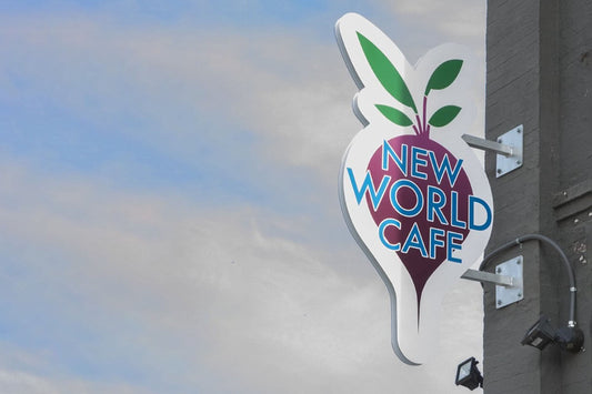 Sign for New World Café vegan restaurant in Des Moines, Iowa