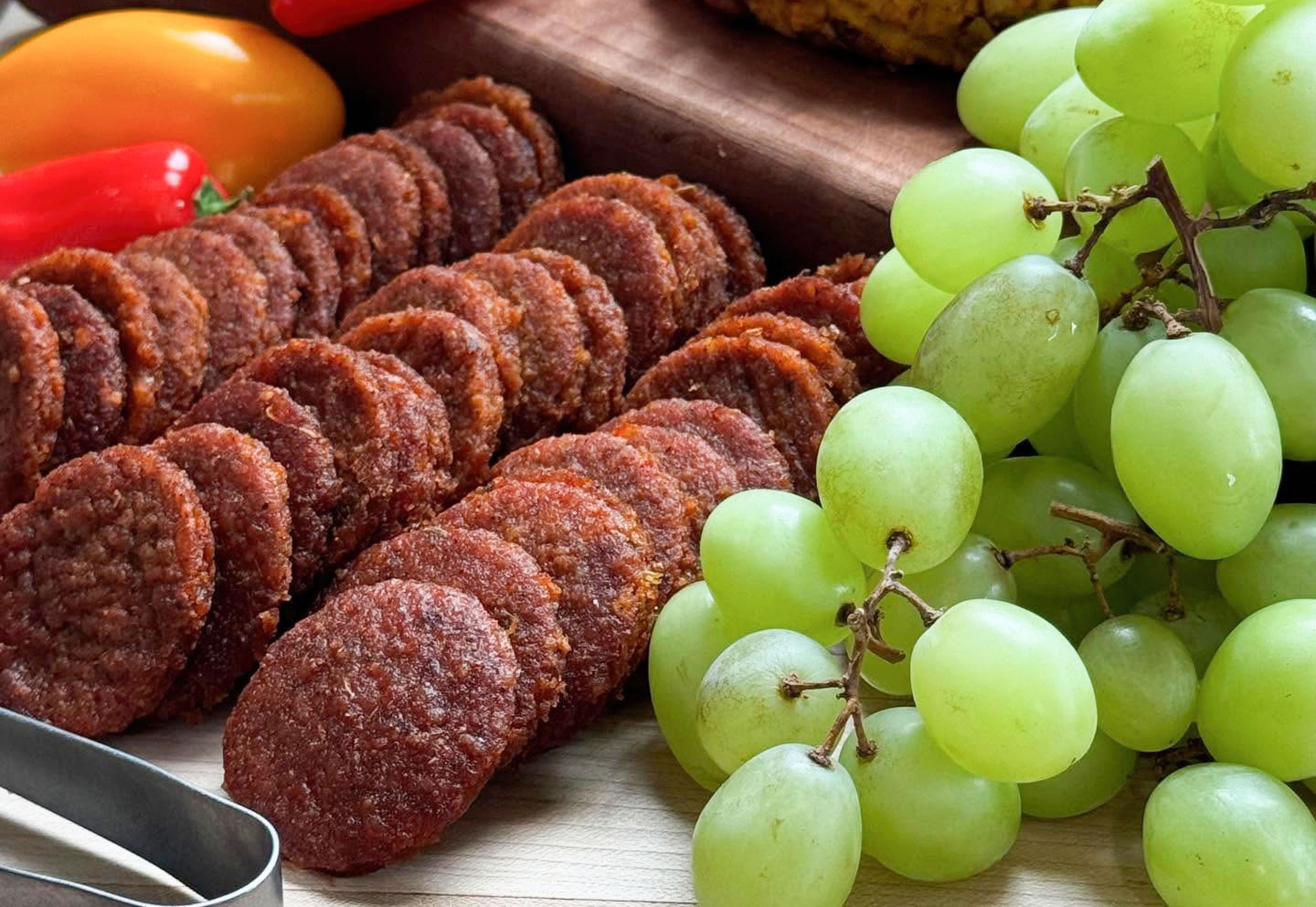 Vegan charcuterie pepperoni slices and grapes in Des Moines, Iowa