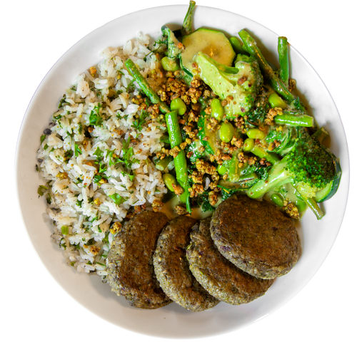 vegan rice and broccoli bowl with asparagus and bean vegetable patties in Des Moines, Iowa